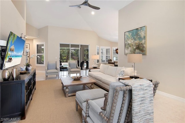 living room featuring ceiling fan and high vaulted ceiling