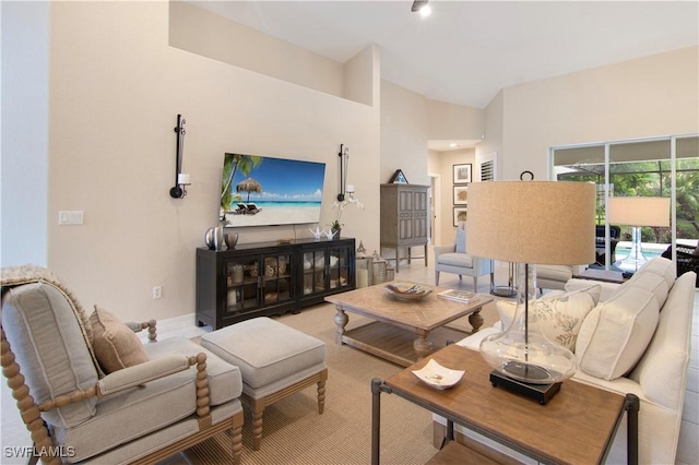 living room featuring vaulted ceiling