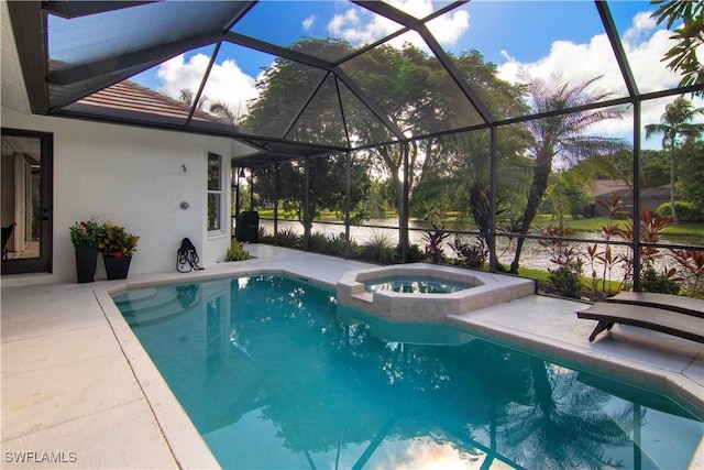 view of swimming pool featuring an in ground hot tub, a lanai, and a patio area