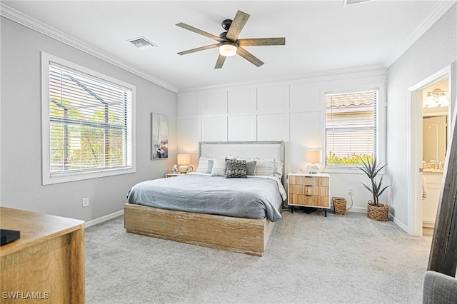 bedroom featuring ceiling fan, light colored carpet, and multiple windows