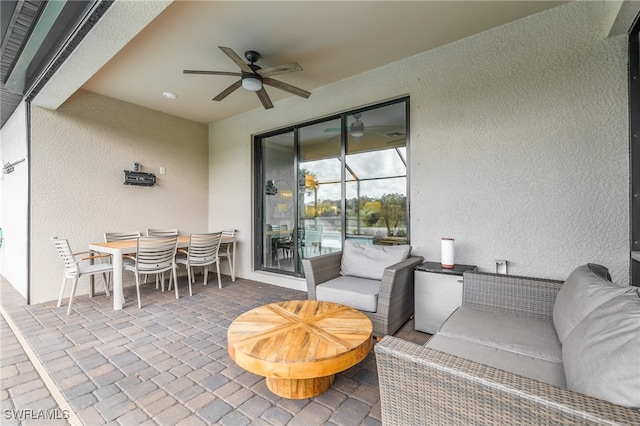 exterior space featuring ceiling fan