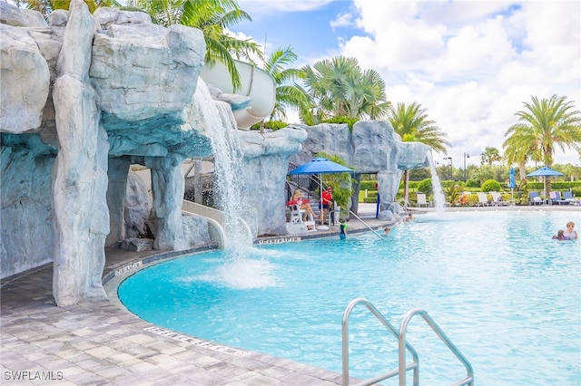 view of swimming pool with a gazebo and pool water feature