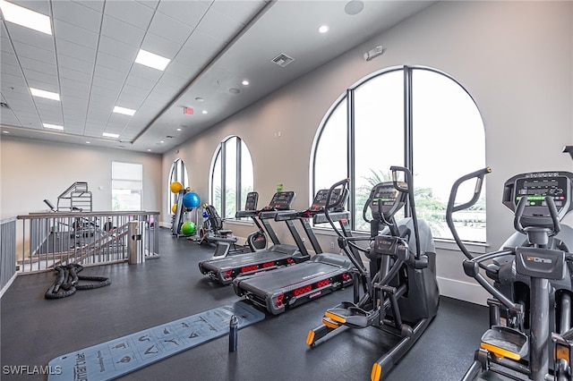 workout area with a paneled ceiling