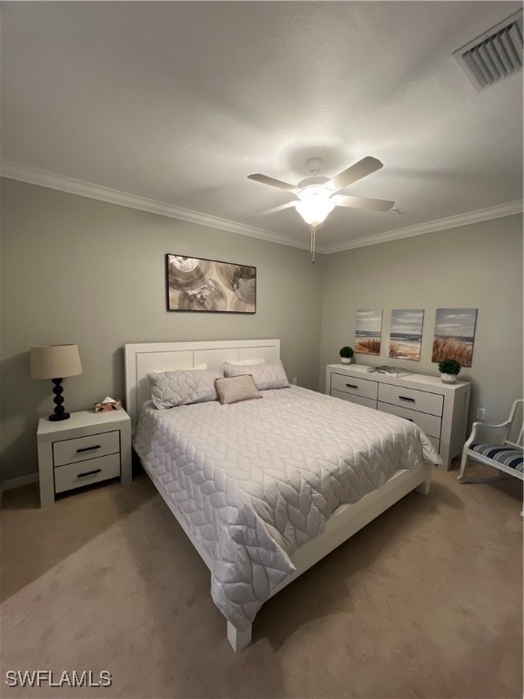 bedroom with ceiling fan, carpet floors, and ornamental molding