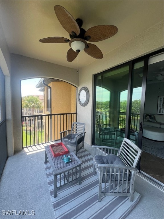 exterior space with ceiling fan