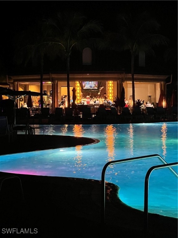 view of pool at night