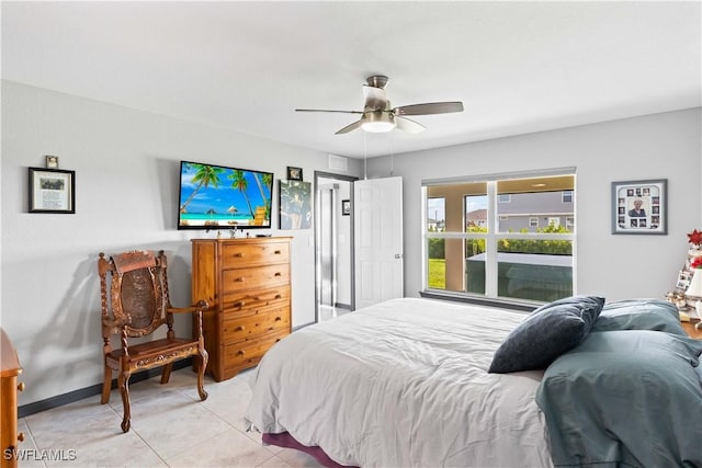 bedroom featuring ceiling fan and light tile patterned floors