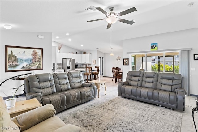 living room featuring ceiling fan and vaulted ceiling