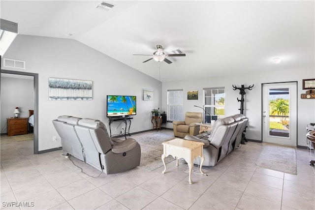 living room featuring ceiling fan, lofted ceiling, and light tile patterned flooring