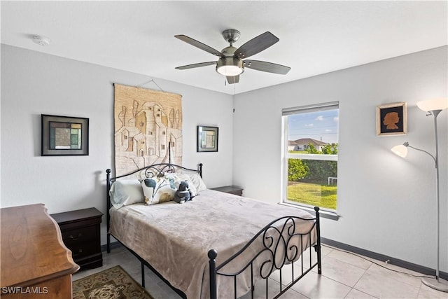 tiled bedroom with ceiling fan