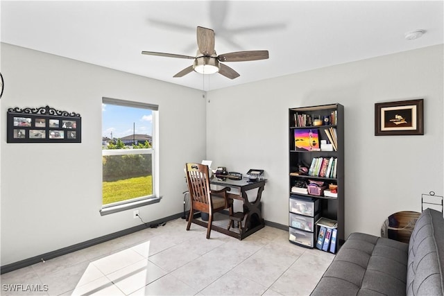 office area with ceiling fan and light tile patterned floors