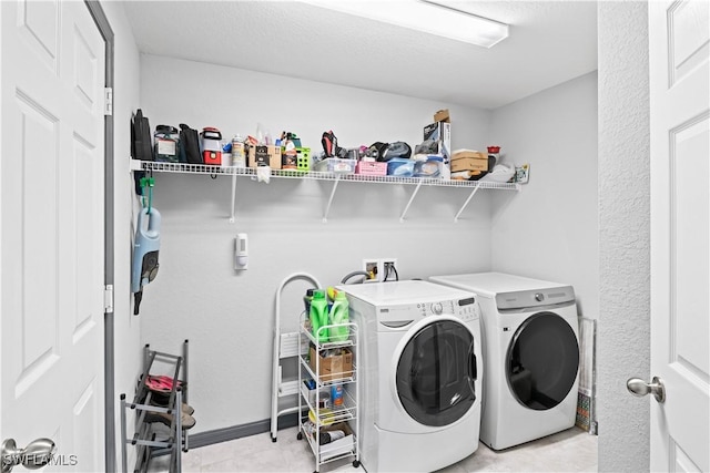 laundry area with washer and clothes dryer