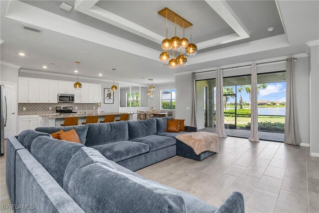 19644 The Place Blvd, Estero, FL 33928 - living area featuring a chandelier, ornamental molding, a raised ceiling, and recessed lighting