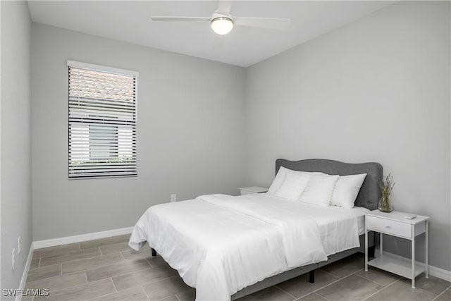 19644 The Place Blvd, Estero, FL 33928 - bedroom with baseboards and ceiling fan