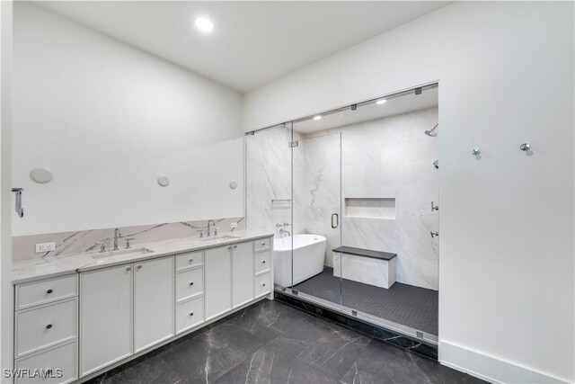 bathroom featuring plus walk in shower and vanity