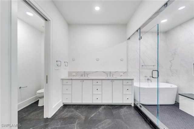 bathroom featuring vanity, toilet, and a bathtub