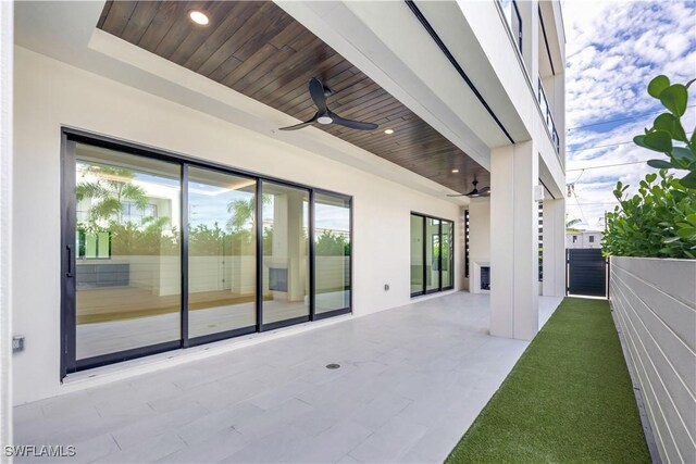 view of patio / terrace featuring ceiling fan