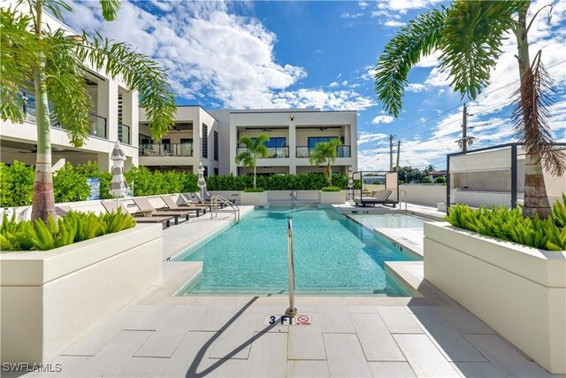 view of swimming pool featuring a patio area