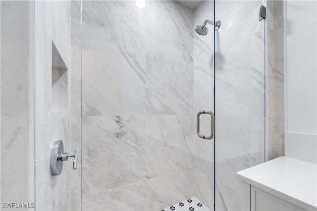 bathroom with vanity and an enclosed shower