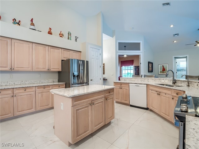 kitchen with light stone countertops, light brown cabinetry, dishwasher, and stainless steel refrigerator with ice dispenser