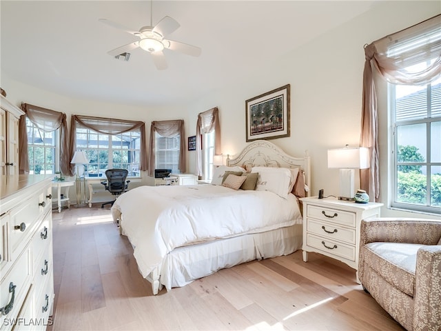 bedroom featuring light hardwood / wood-style floors and ceiling fan