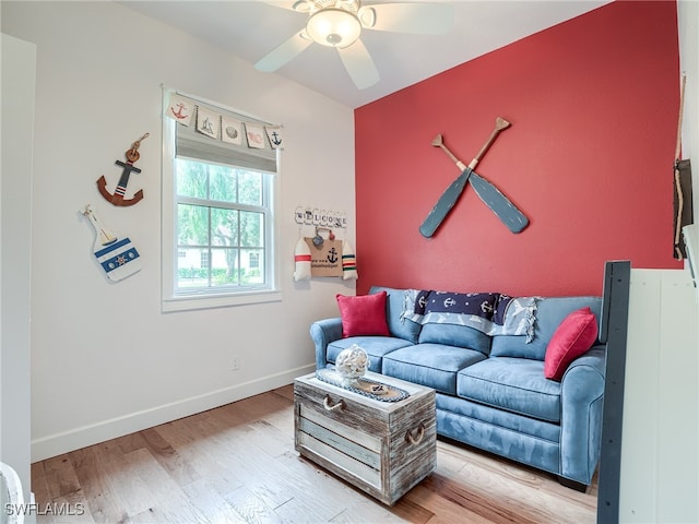 living room featuring light wood-type flooring and ceiling fan