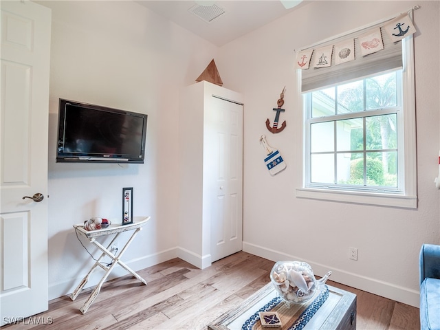 sitting room with light wood-type flooring