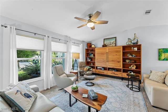 living room featuring light carpet, lofted ceiling, and ceiling fan