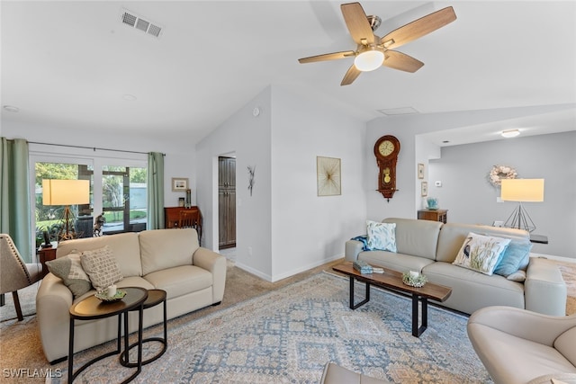 carpeted living room featuring vaulted ceiling and ceiling fan