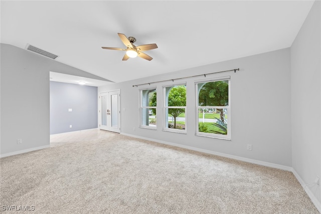 spare room with ceiling fan, carpet, and lofted ceiling