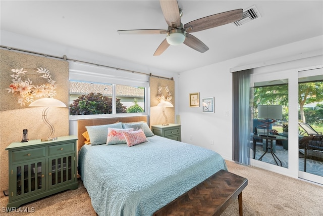 carpeted bedroom with ceiling fan and access to outside