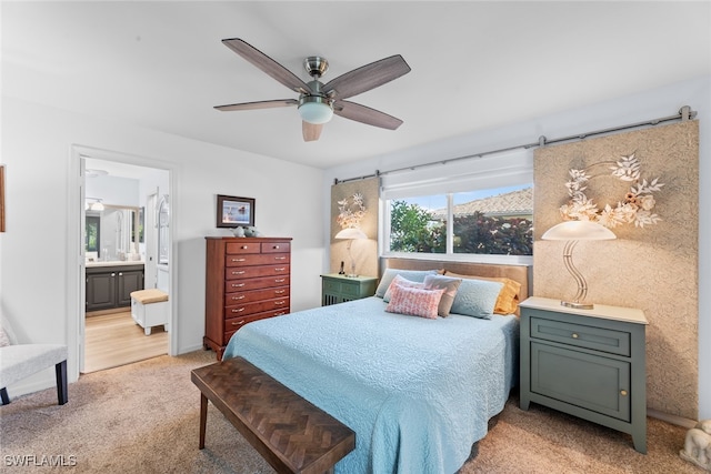 carpeted bedroom featuring ensuite bathroom and ceiling fan