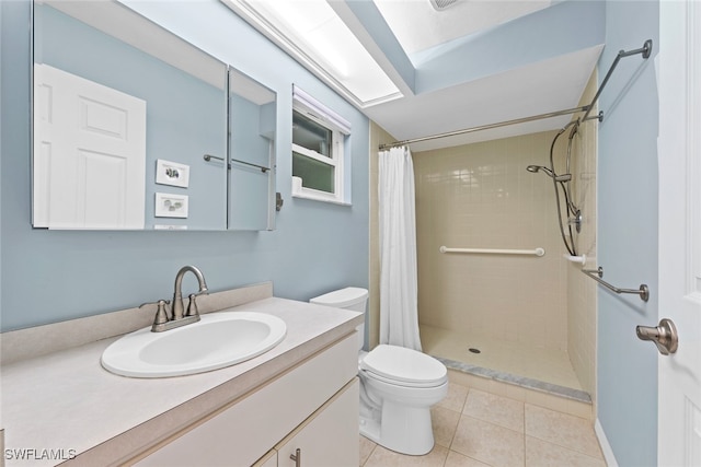 bathroom featuring vanity, toilet, tile patterned floors, and a shower with shower curtain