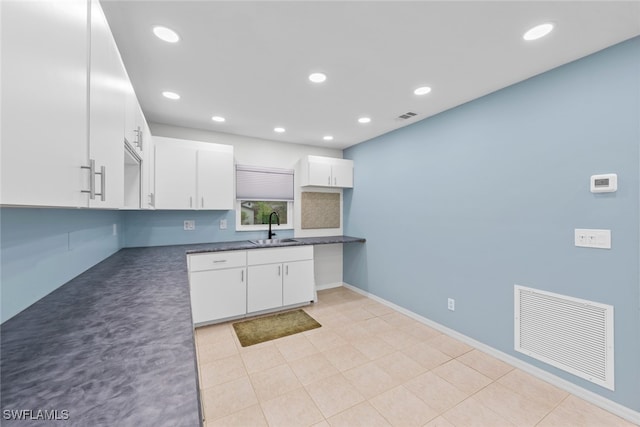 kitchen with white cabinets and sink