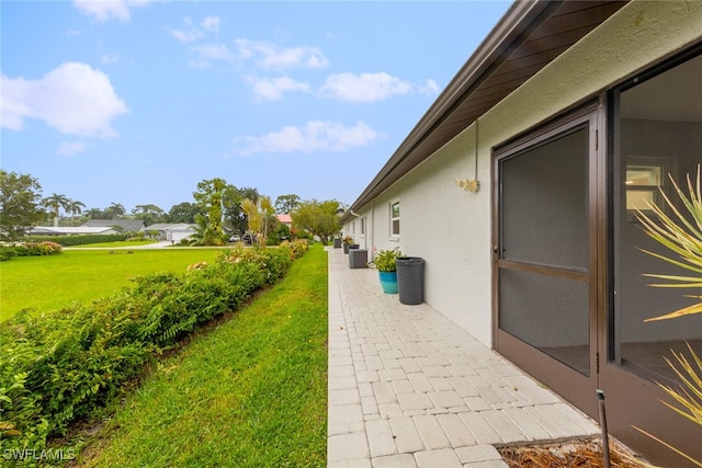 view of side of property featuring a lawn