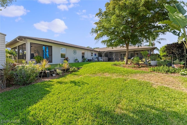 view of yard with a sunroom