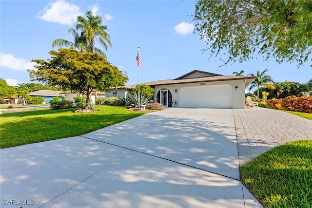 ranch-style home with a front yard and a garage