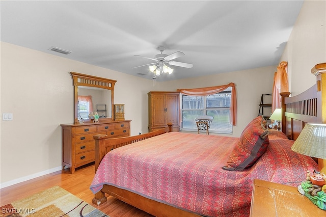 bedroom with light wood-type flooring and ceiling fan