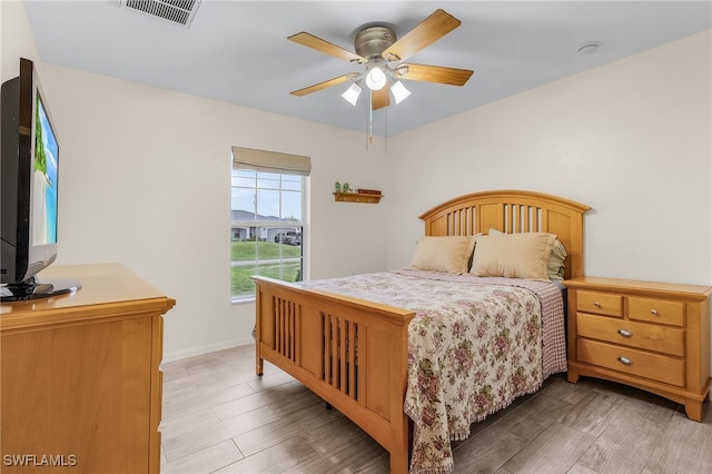 bedroom featuring wood-type flooring and ceiling fan