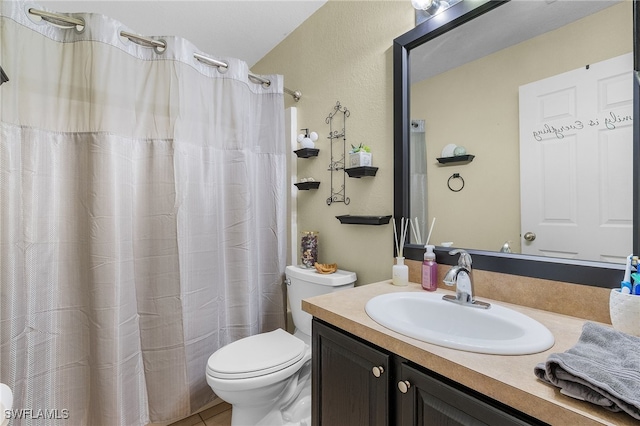 bathroom with walk in shower, tile patterned flooring, vanity, and toilet