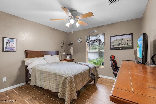 bedroom with hardwood / wood-style flooring and ceiling fan