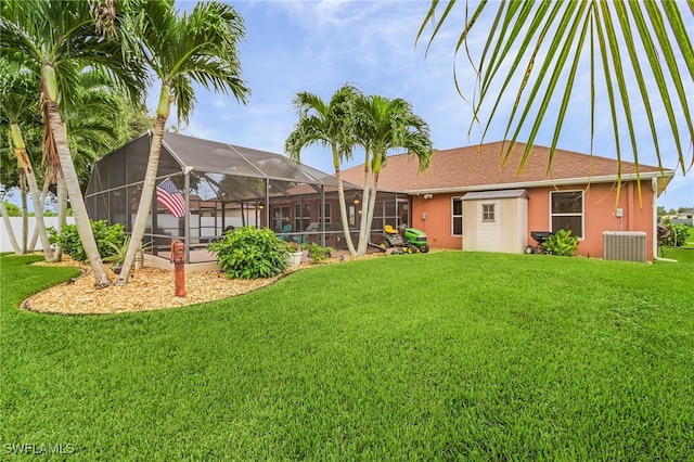 view of yard with a swimming pool and a lanai