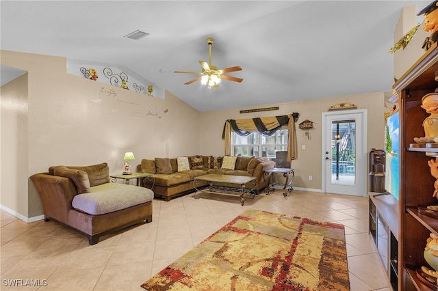 tiled living room featuring ceiling fan and lofted ceiling