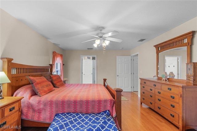 bedroom with ceiling fan and light hardwood / wood-style floors