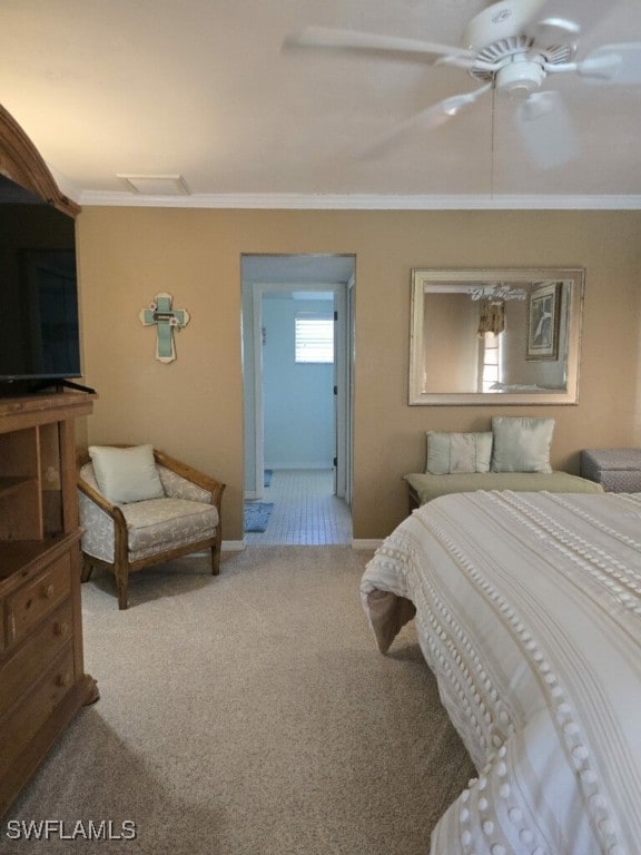 bedroom featuring ceiling fan, ornamental molding, and carpet floors