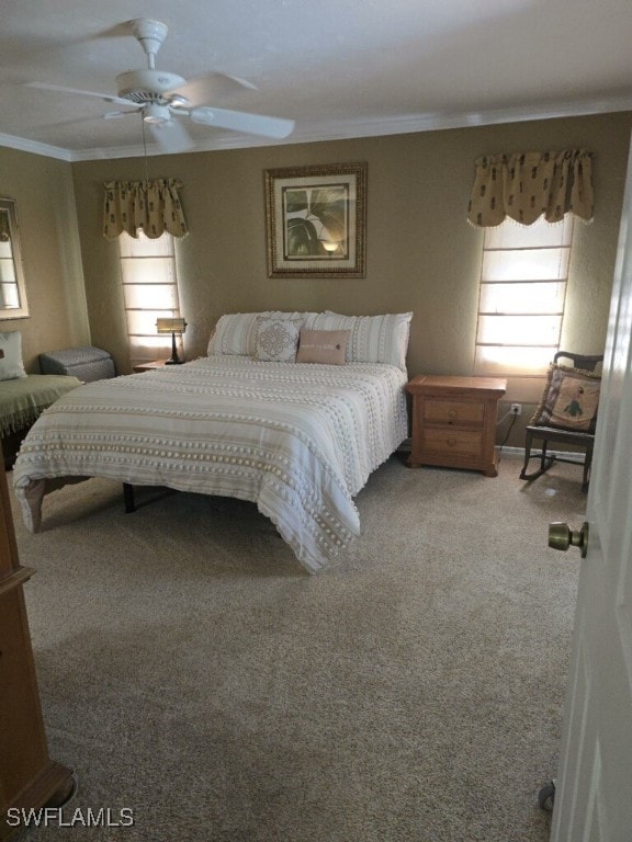 bedroom featuring carpet flooring, ceiling fan, and ornamental molding