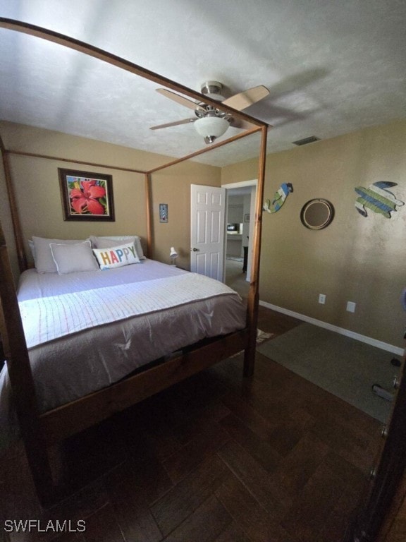 bedroom with a textured ceiling and ceiling fan