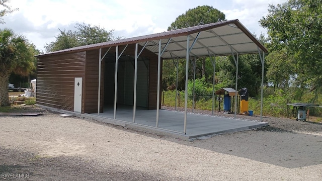 view of parking / parking lot with a carport