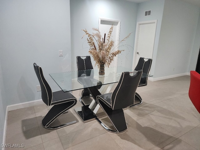 dining room featuring light tile patterned flooring