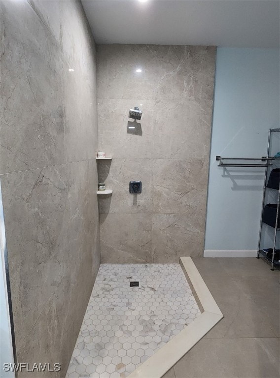 bathroom with a tile shower